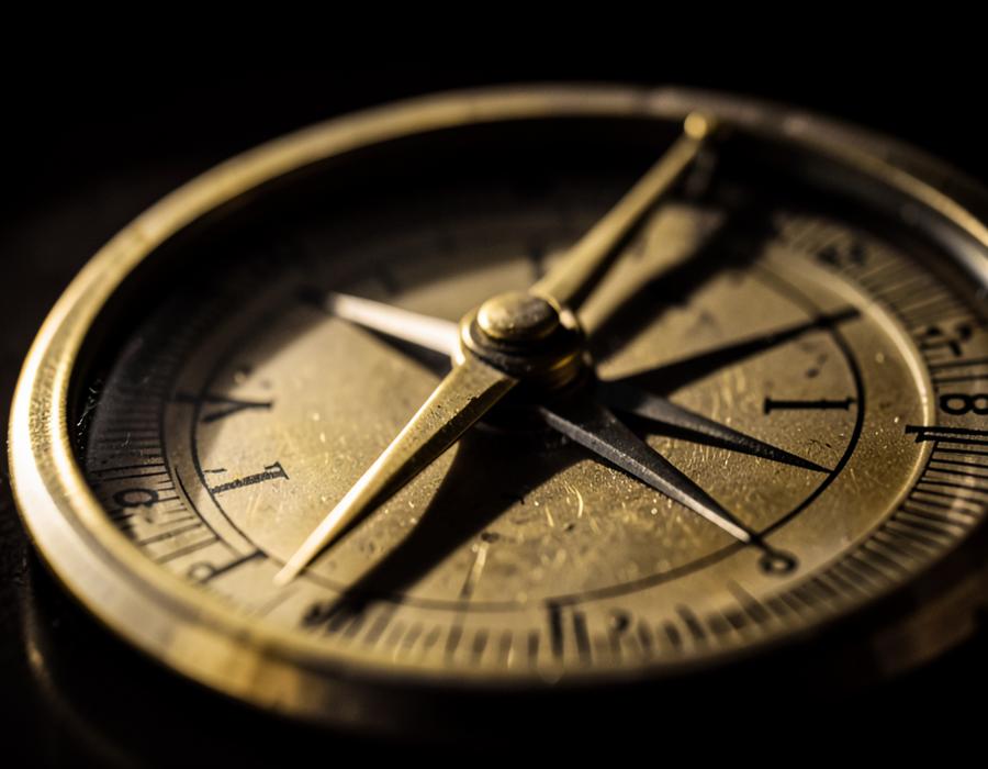 Close-up of an antique brass compass